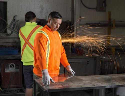 worker at manufacturing facility wearing PPE